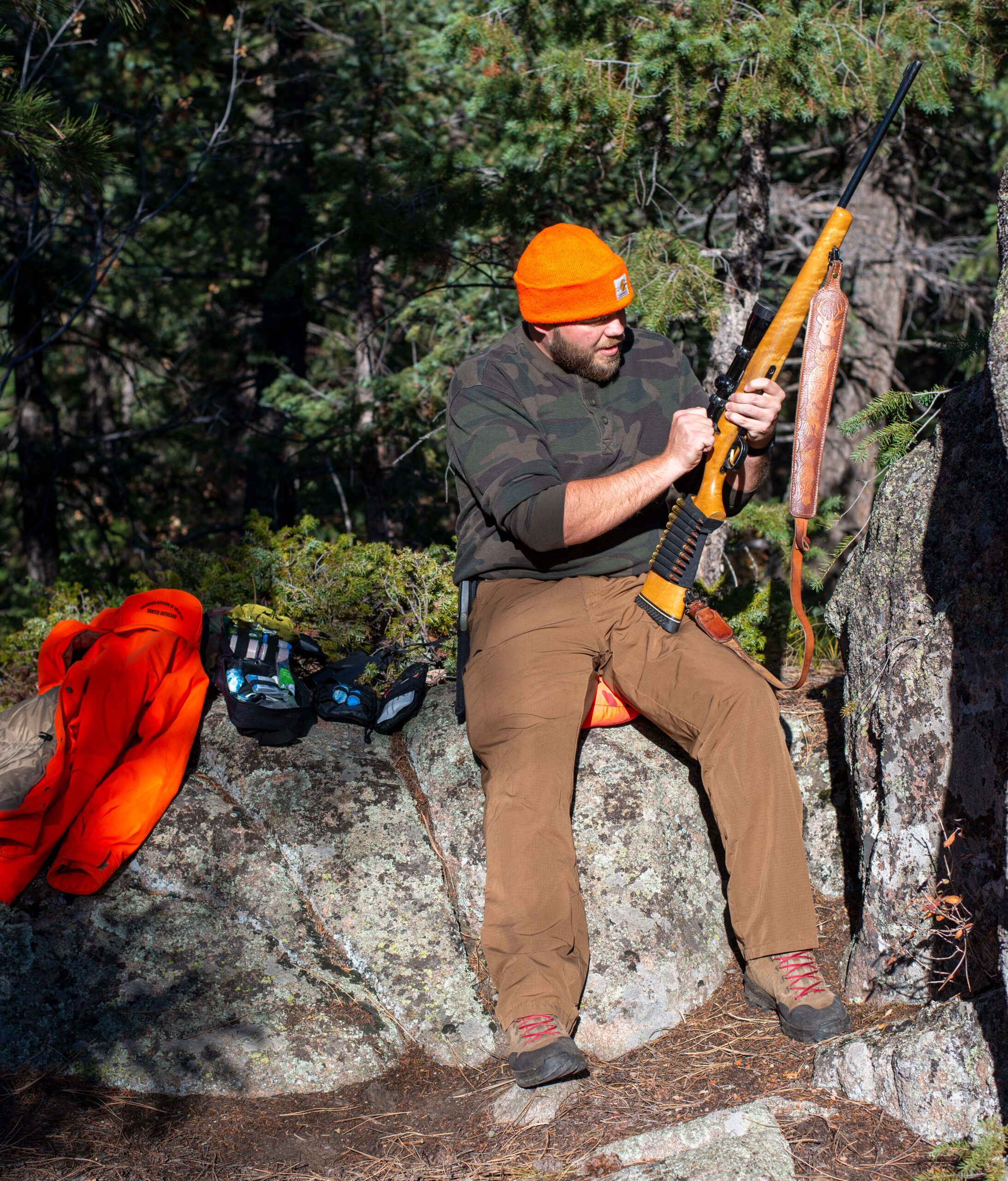 Hunter in the backcountry with medical equipment nearby
